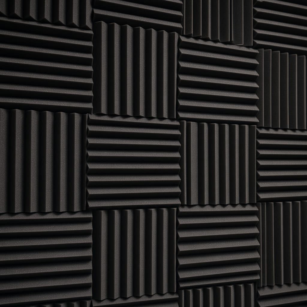 Black wedge acoustic foam wall in a voiceover booth