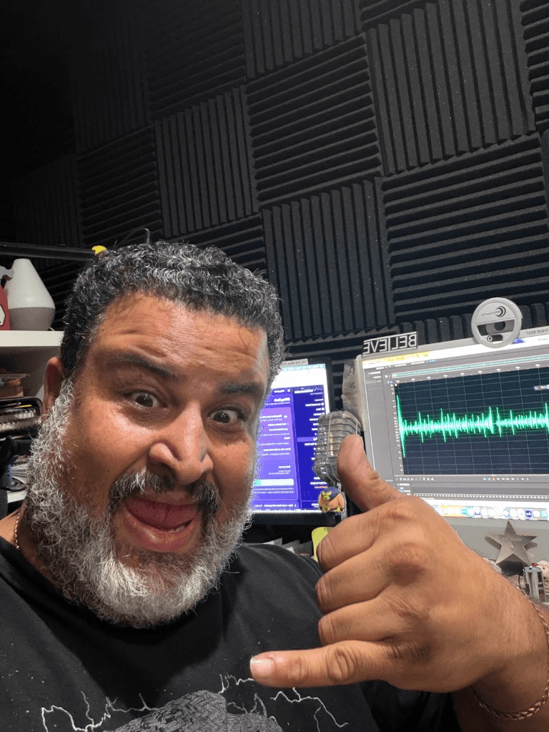 Giuseppe hanging loose at the mic with monitors and DAW visible